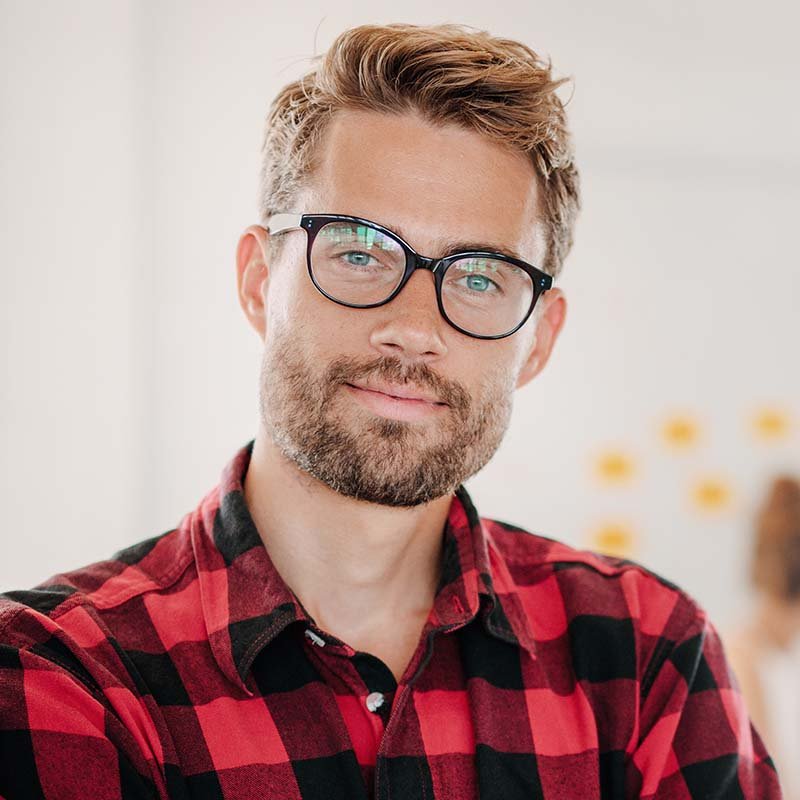 portrait of positive businessman in office PNPWR2X.jpg